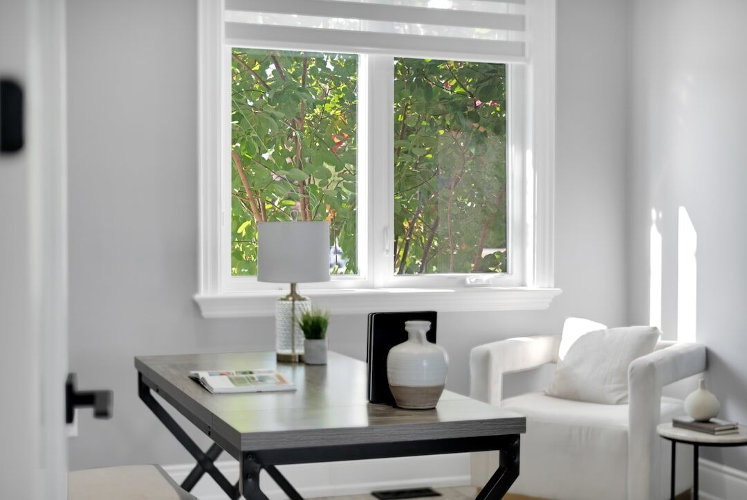 Editorial office with large windows and layout boards on the wall