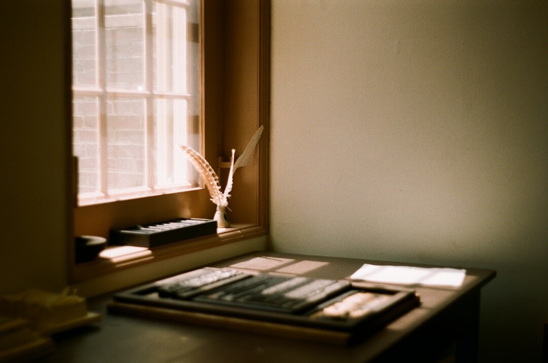 Editor's desk with layout proofs, a fountain pen and coffee cup